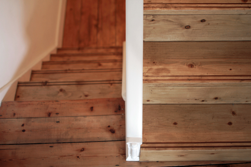 European redwood stair cladding with teak edge detail. Lower Clapton, London E5 
