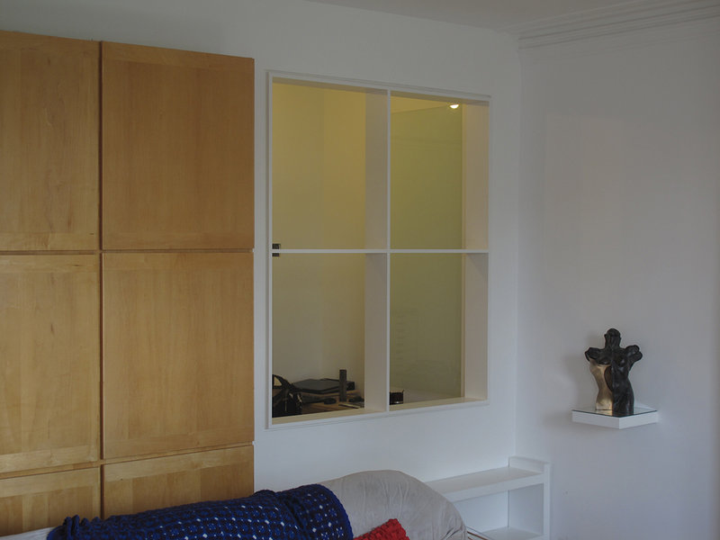 Home office remodeled. New wall opening with 4 frameless individually hinged & frosted glass panels. Hampstead NW3, London 