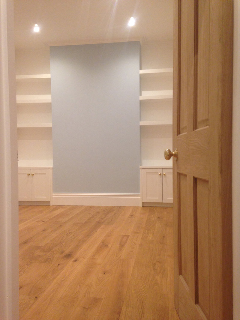 New solid oak door & floor installation. Custom design and built alcove cabinets and floating shelves. Room re-plastered and detail finished. 
Flat refurbishment, Beulah Hill SE19, London 